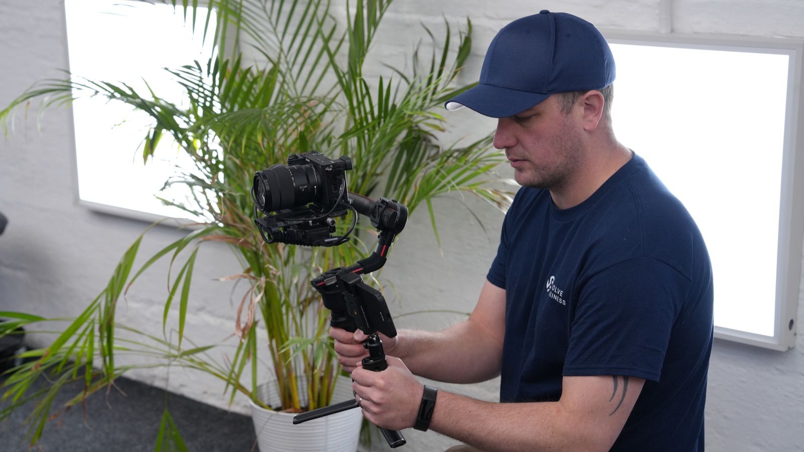 Ryan Walker filming with a camera on a handheld gimbal